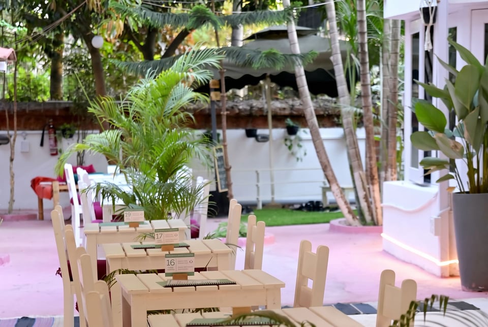 Café tables on the red garden floor